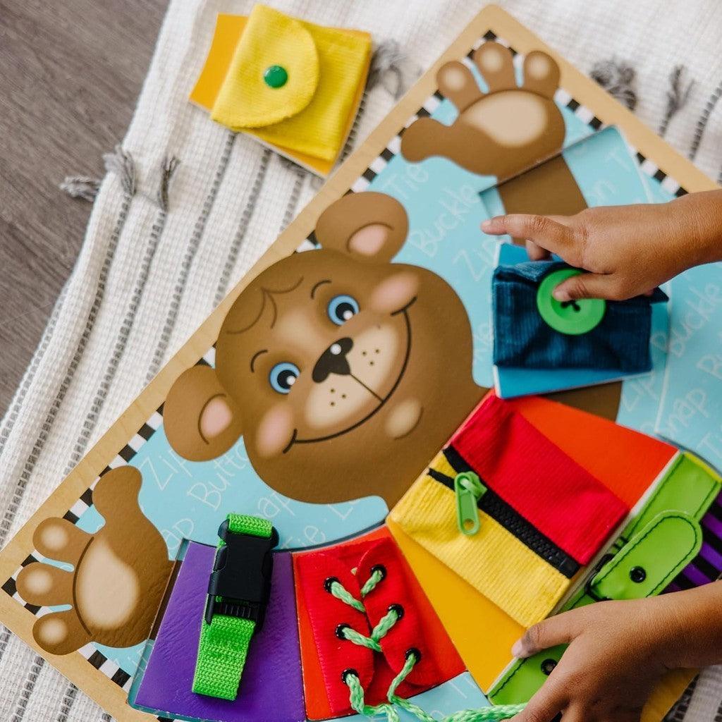 Melissa & Doug Basic Skills Puzzle Board-Wooden Educational Toy-Learn To Button Busy Board, Activity Board